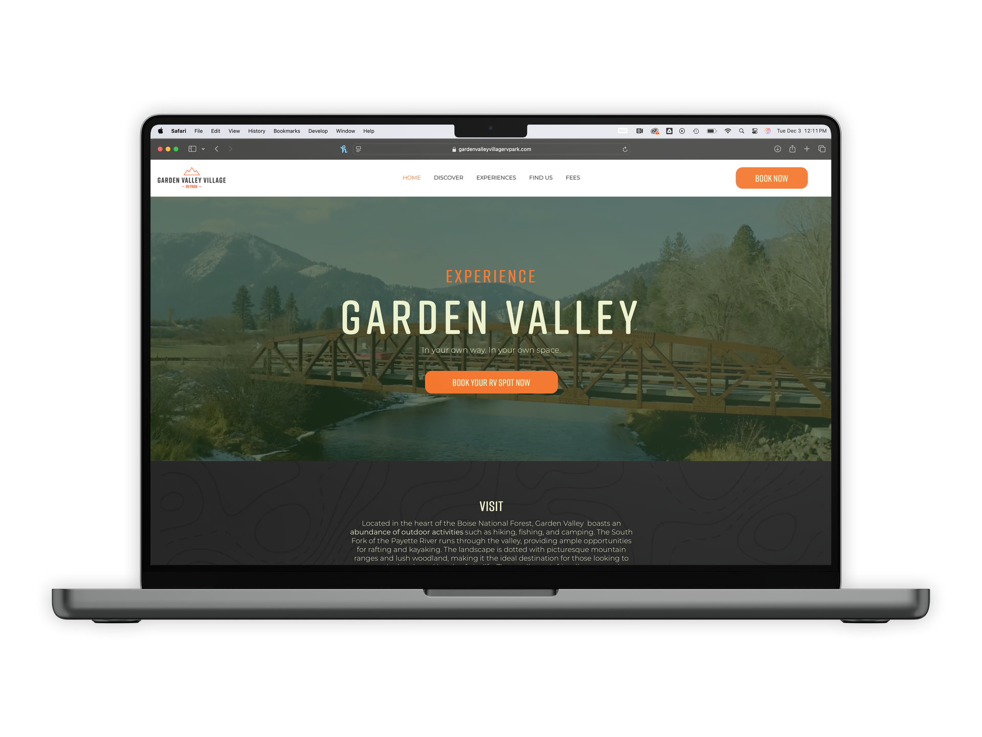 A laptop computer is open to a garden valley website.