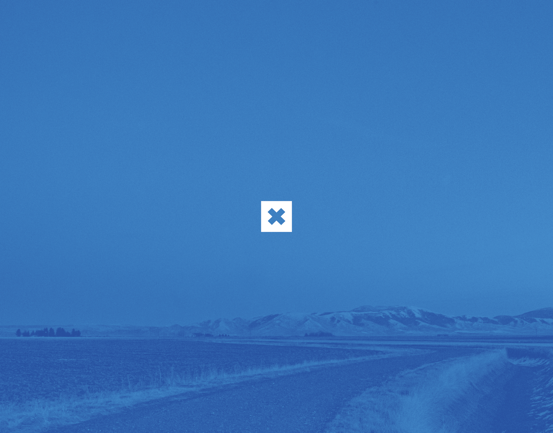 A blue sky with a white cross in the middle of it.