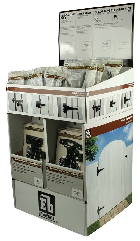 A cardboard display with a picture of a white gate on it.