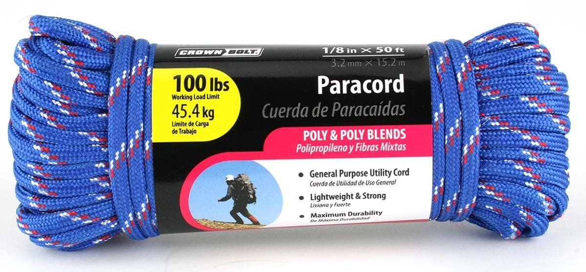 A spool of blue and red paracord is sitting on a white surface.