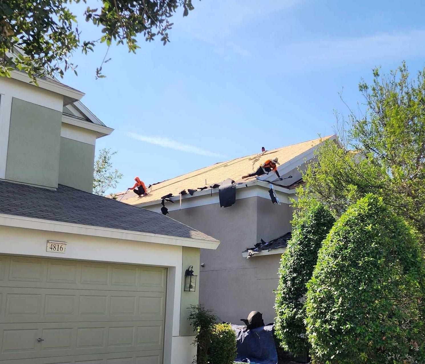 Workers Removing the Old Roof