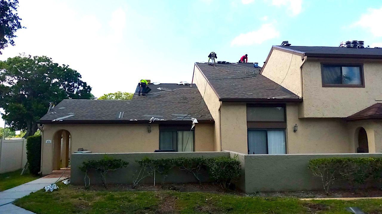 Workers Replacing the Old Roof