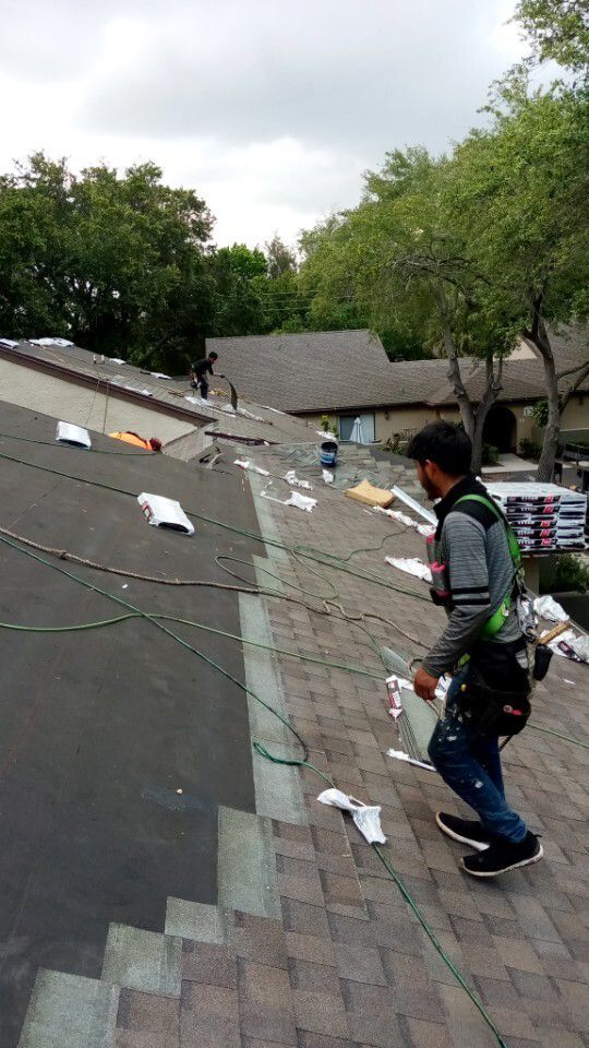 Worker Installing a Shingle Roof