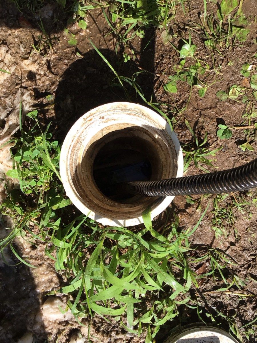 A long hose line inside of the sewer