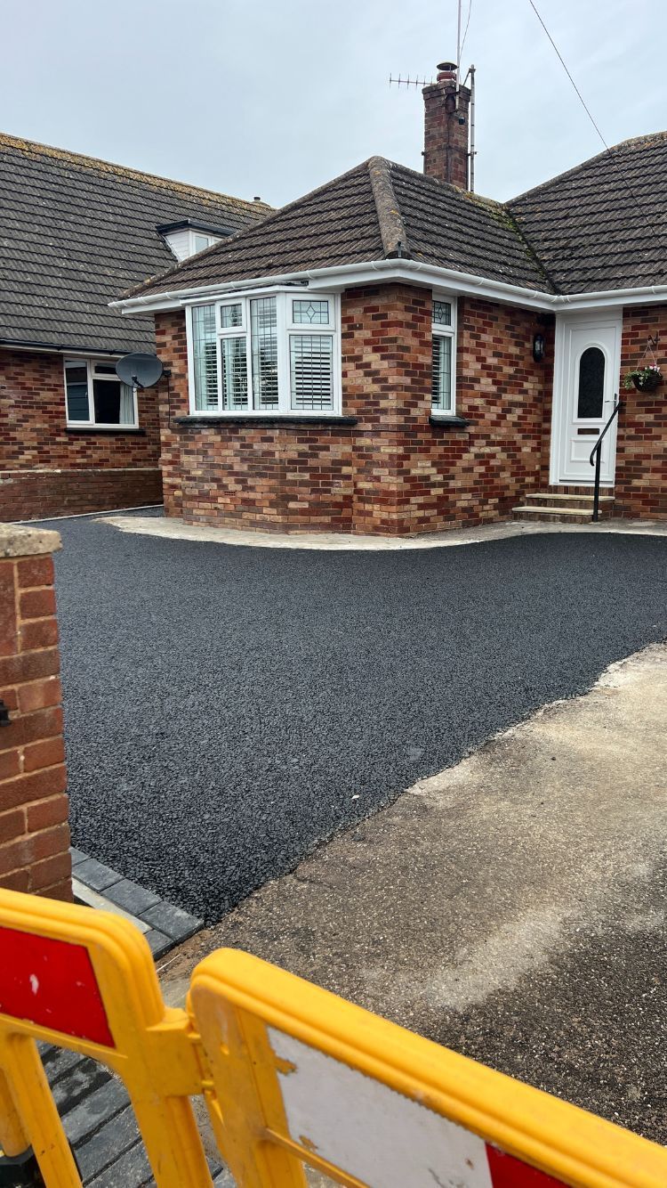 After applying permeable tarmac on a driveway.