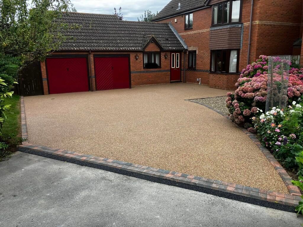 Resin driveway installation with a price per square meter.