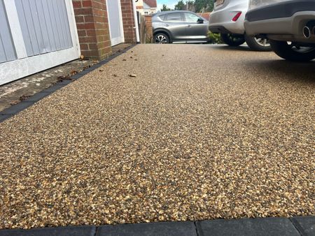 Resin driveway installed 10 years ago in a sandy colour but still looks brand new.