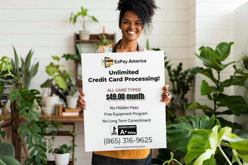 A woman is holding a sign that says `` unlimited credit card processing ''.