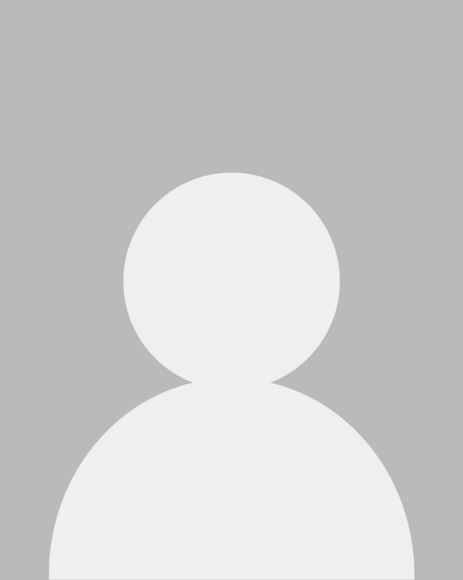 A silhouette of a person without a face on a gray background.