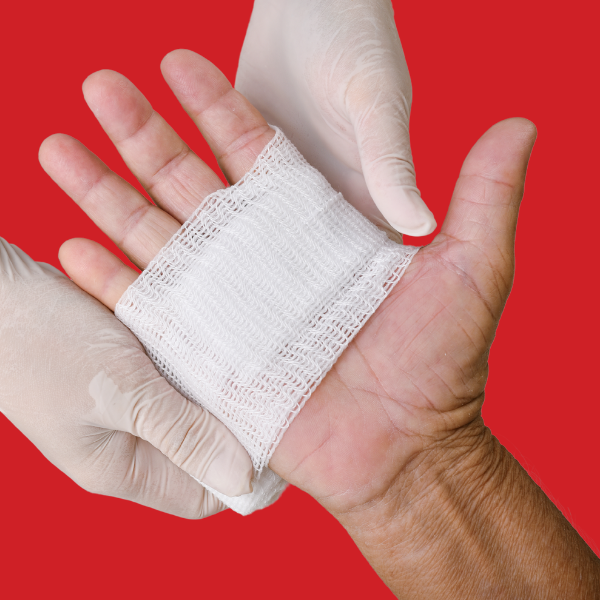 A bandage is being applied to a person 's hand