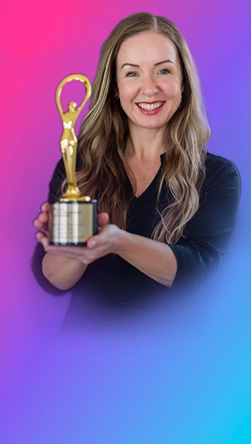 Woman holding a golden trophy, smiling. Against a purple and pink gradient backdrop.