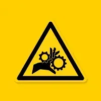 Yellow warning sign with gears and hand, indicating machinery hazard