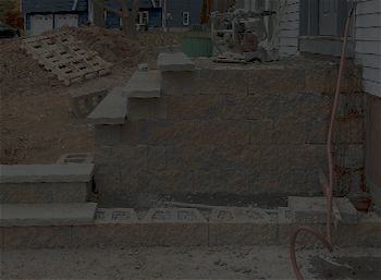 A staircase is being built in front of a house.