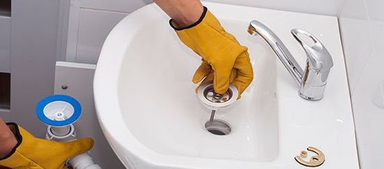 Drain Cleaning Service — Plumber Installs New Siphon in Omaha, NE