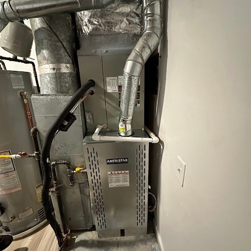 There is a heater and a water heater in the room.