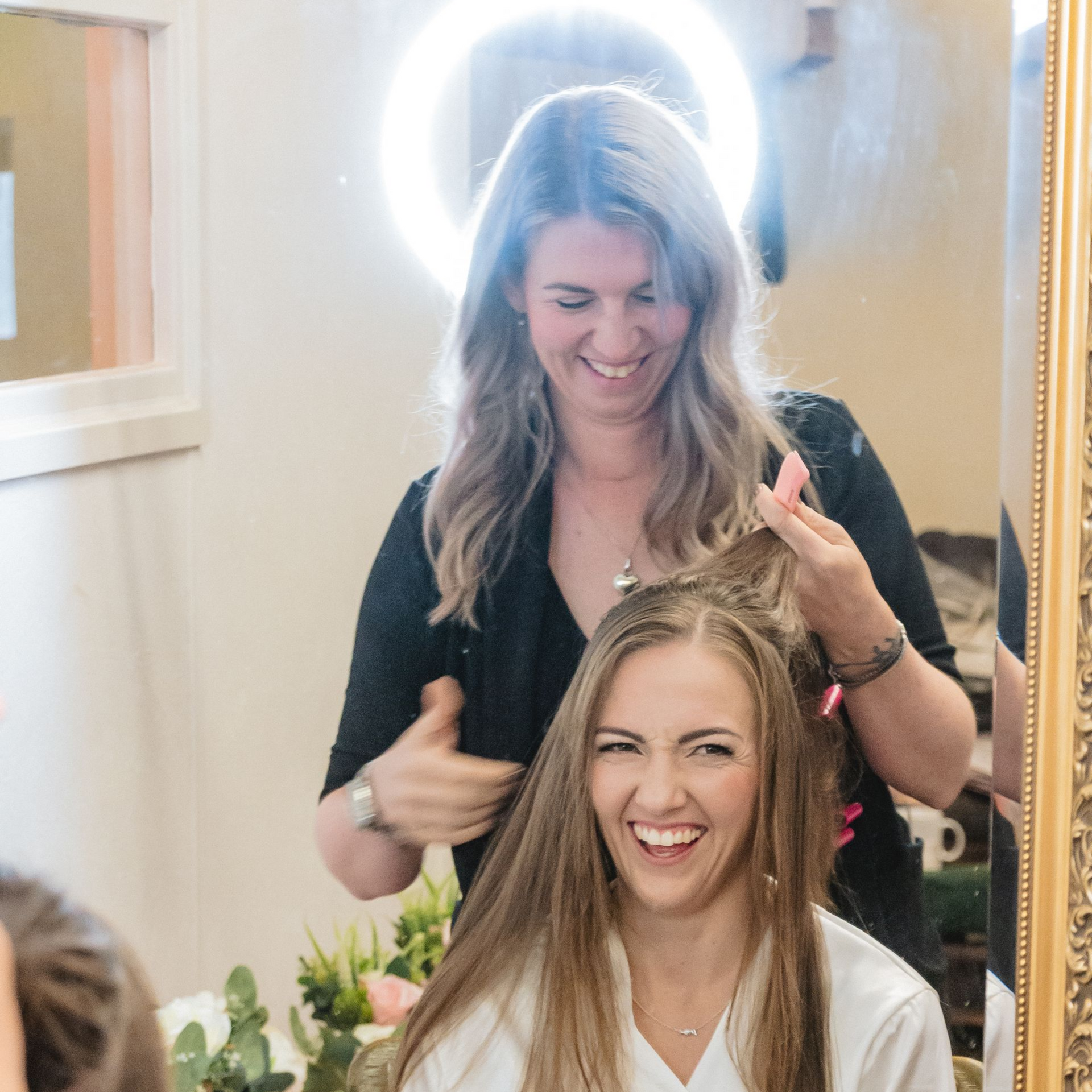 bride enjoying wedding morning with bridal hair and makeup by Jax-Glam Beauty Bristol