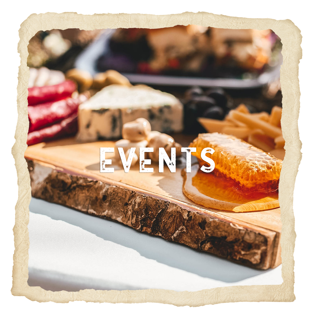 A wooden cutting board with the word events written on it