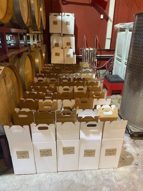 A warehouse filled with lots of boxes and barrels