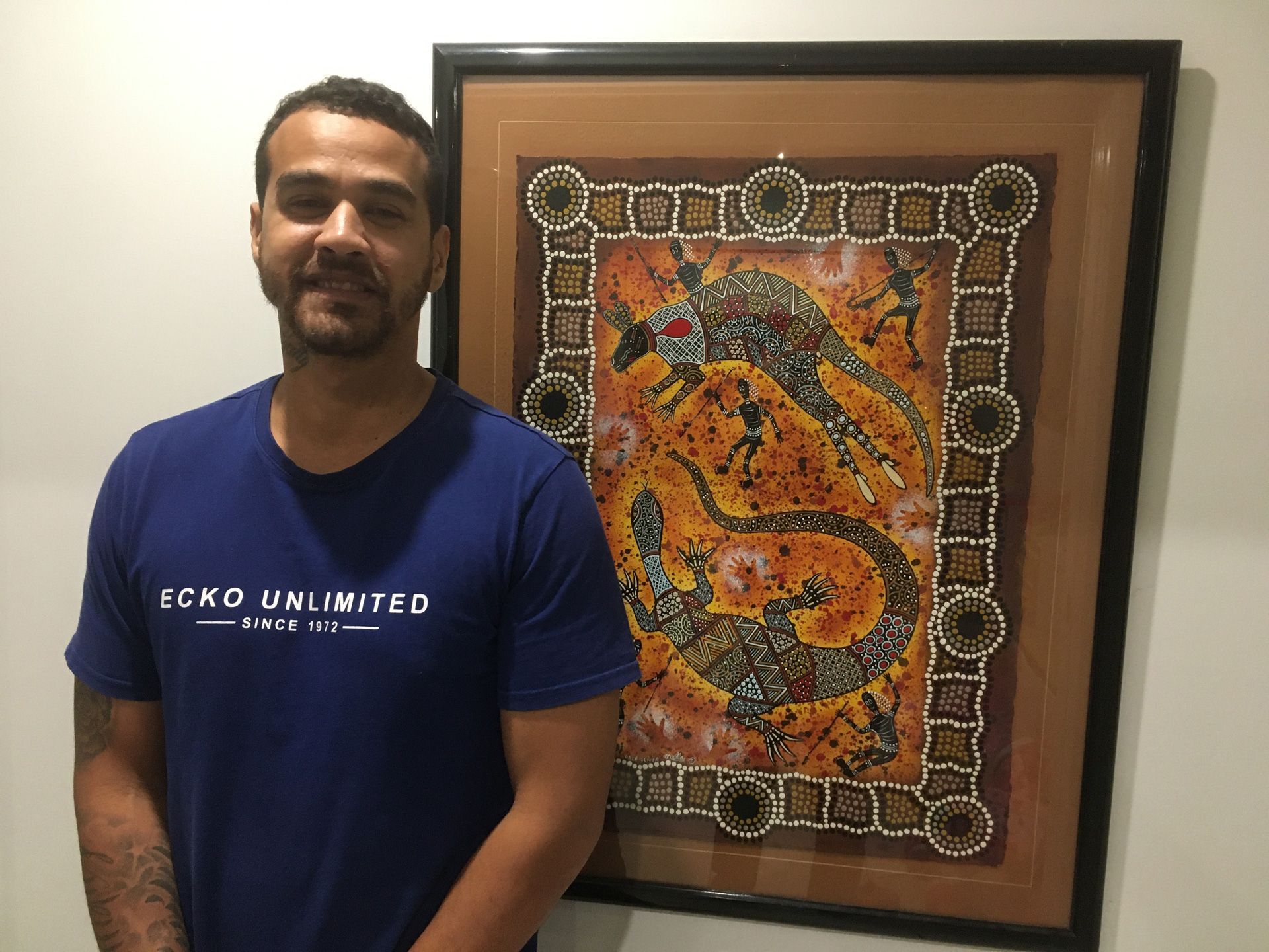 Man with Picture Behind | Cairns, QLD | Pegasus Studios