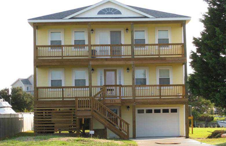 Yellow Two Story House – Kill Devil Hill, NC – DeBoy Construction & Remodeling