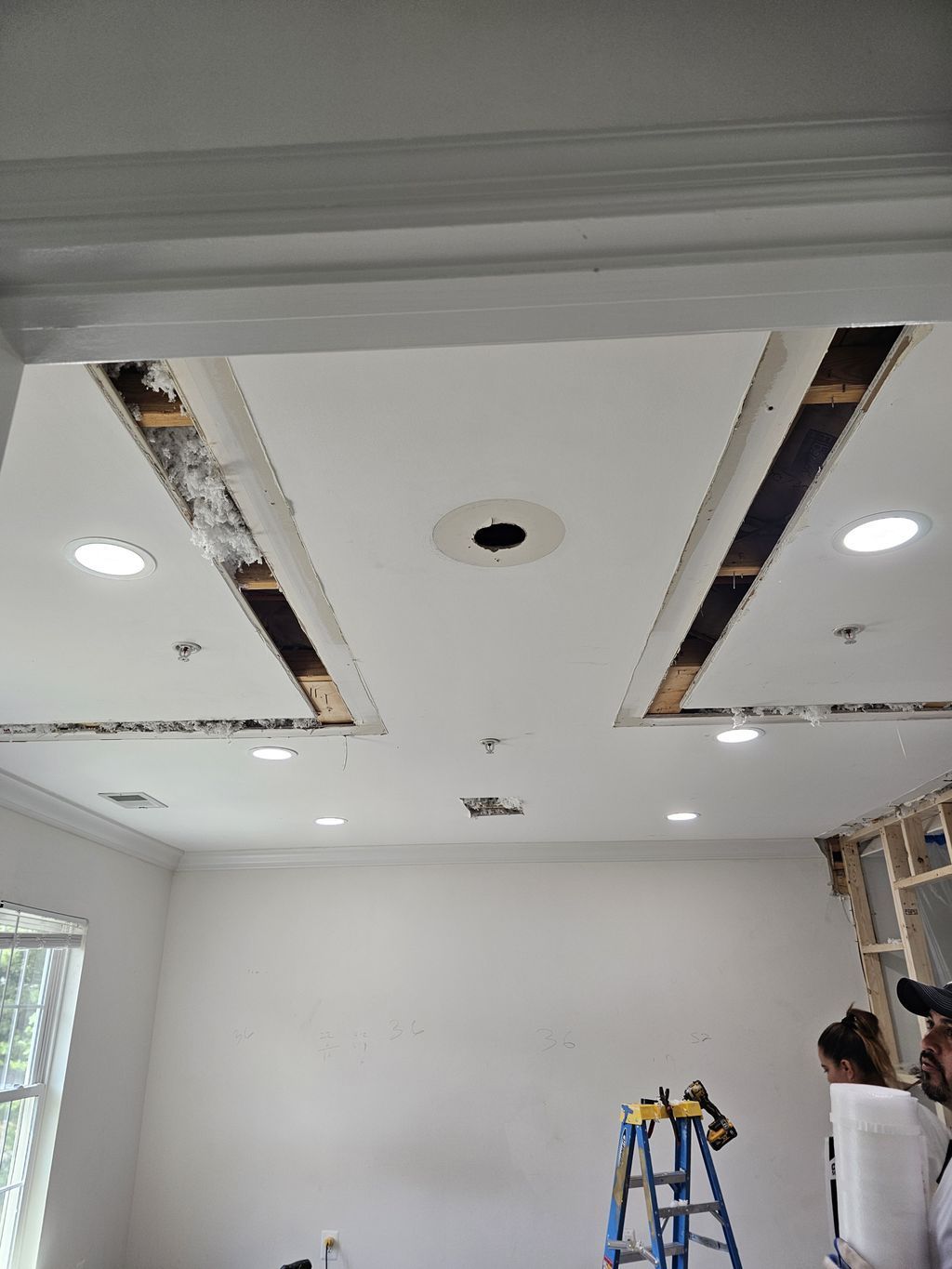 A room with a ceiling that is being remodeled.