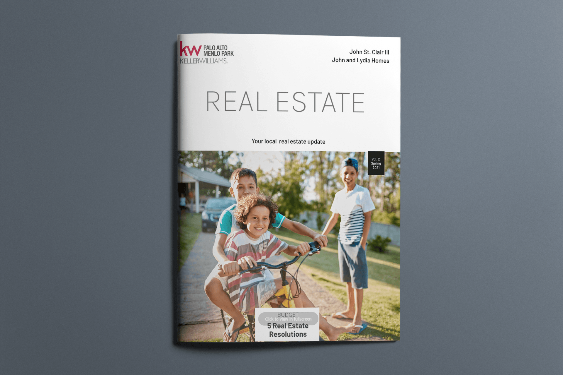 A real estate brochure with a family on a bike on the cover.