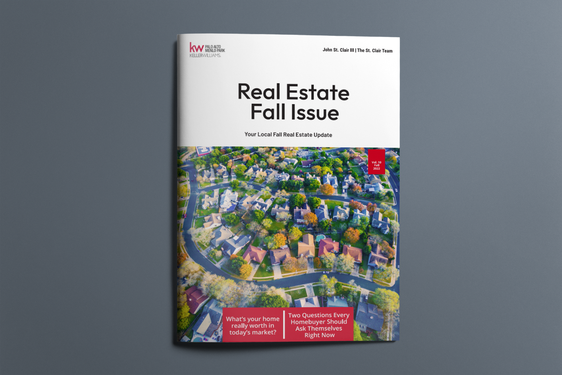The cover of a real estate fall issue magazine with an aerial view of a residential area.