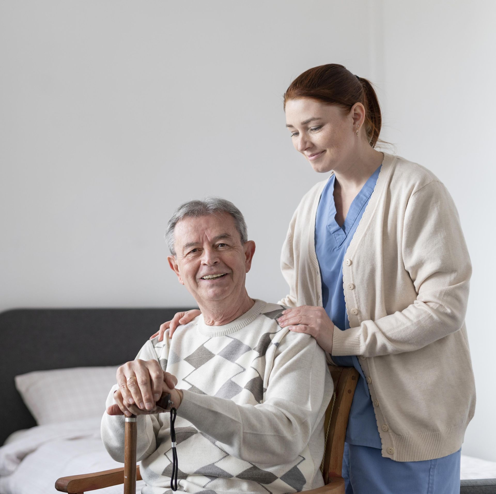 Two men in suits are shaking hands on a balcony.