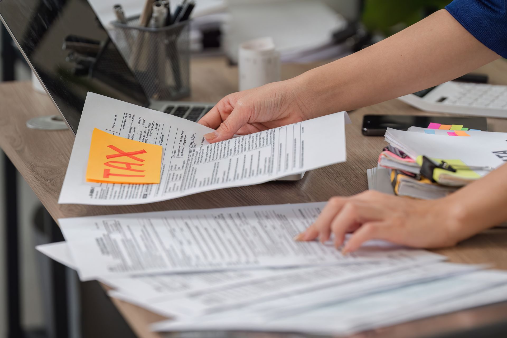 Organizing tax documents while preparing for filing and calculations. Organizing tax documents while preparing for filing and calculations.