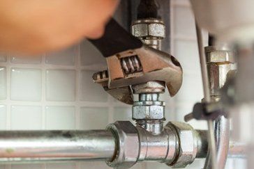 Hand Repairing Pipes — Plumbing In Lutz, FL