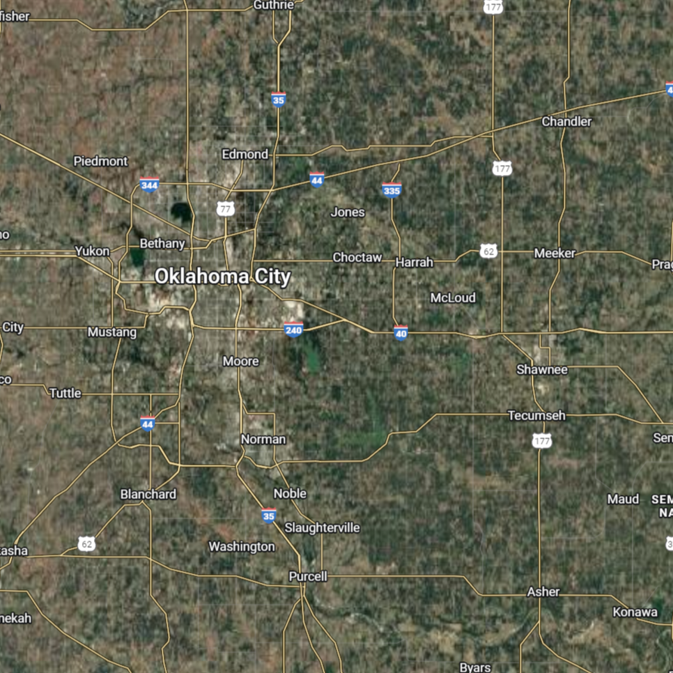 Satellite view of Oklahoma, with Oklahoma City at the center, surrounded by towns and highways.