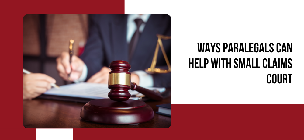 A judge is sitting at a table with a gavel and a scale of justice.