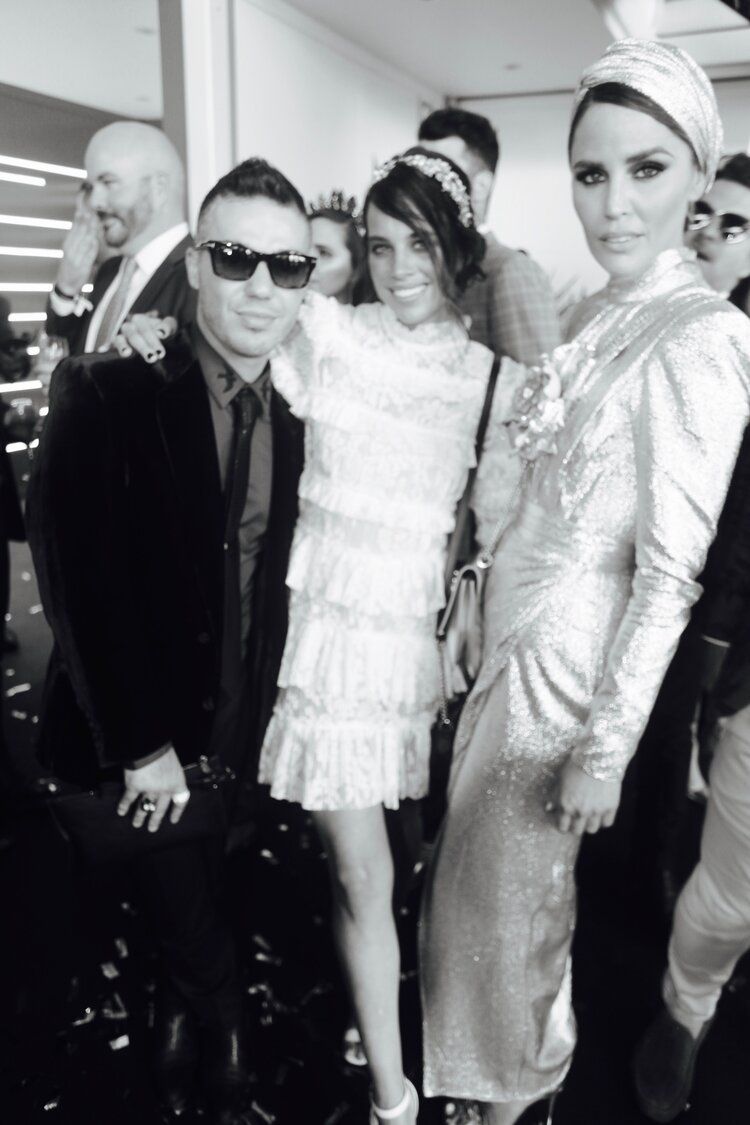 A black and white photo of a group of people posing for a picture