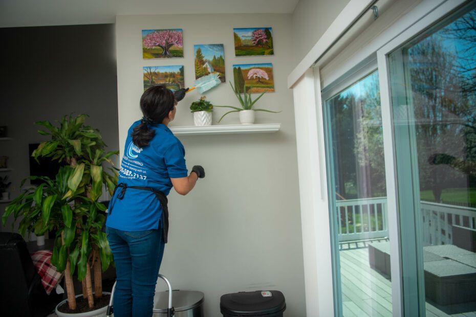 a woman wearing a blue shirt that says cleaning on it