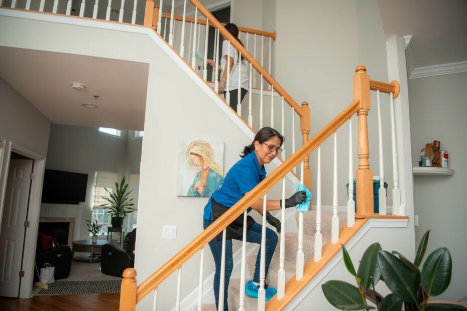 a woman cleaning the stairs
