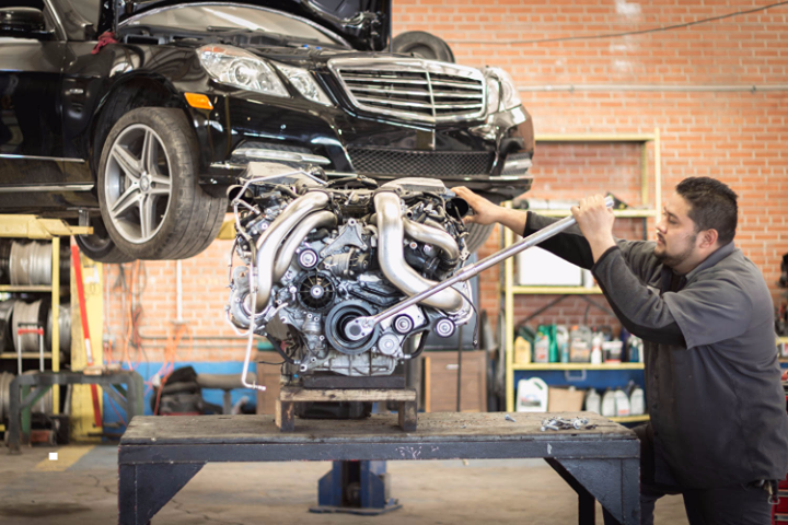 Mechanic Fixing Car Engine — Houston, TX — Lonestar Imports