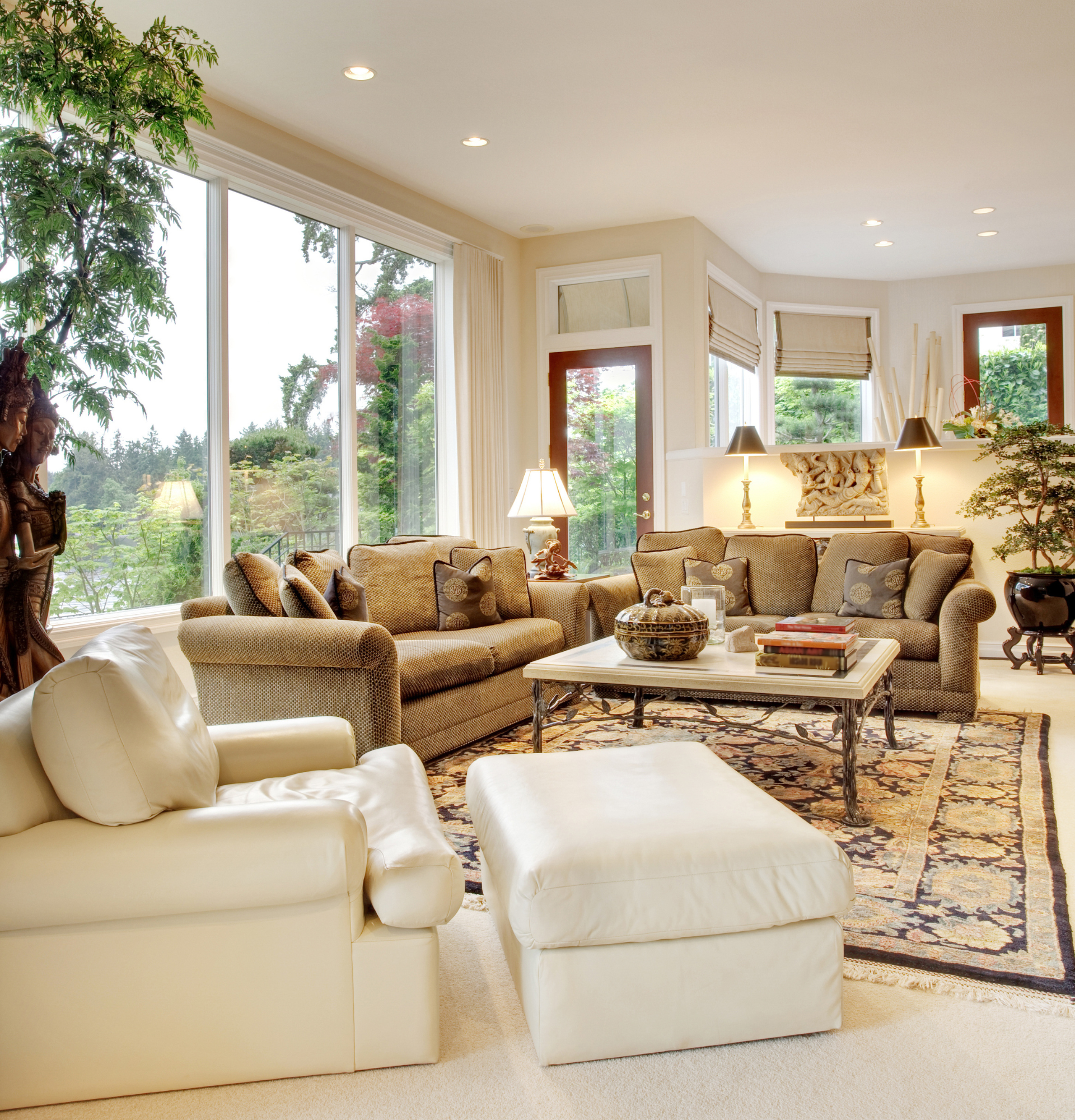 A living room with lots of furniture and a large window