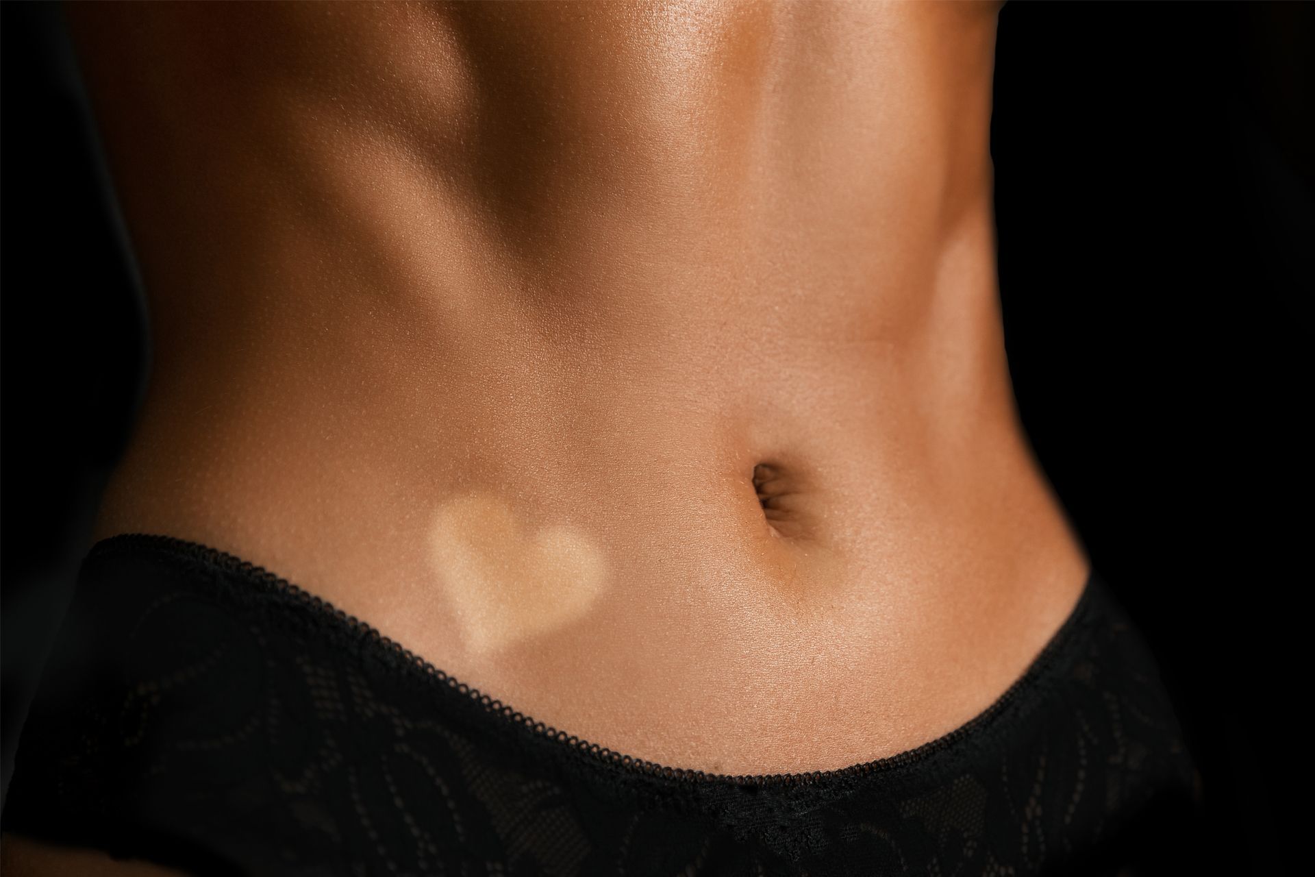 A woman 's back is shown with water drops on it