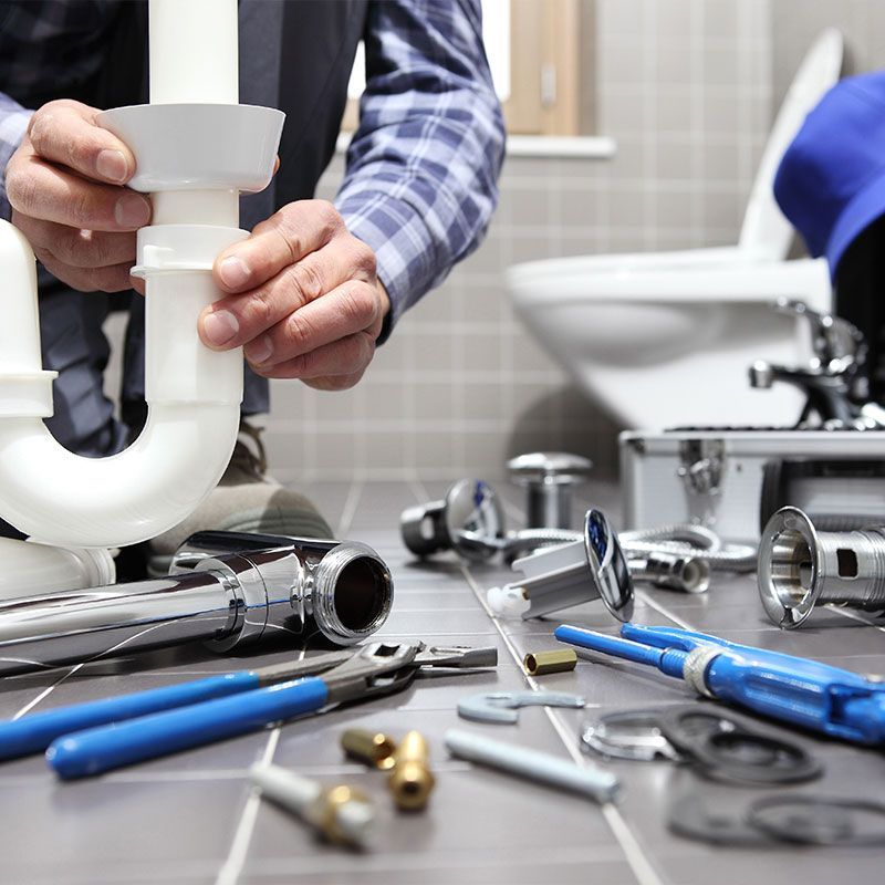plumber at work in a bathroom, plumbing repair service, assemble and install concept