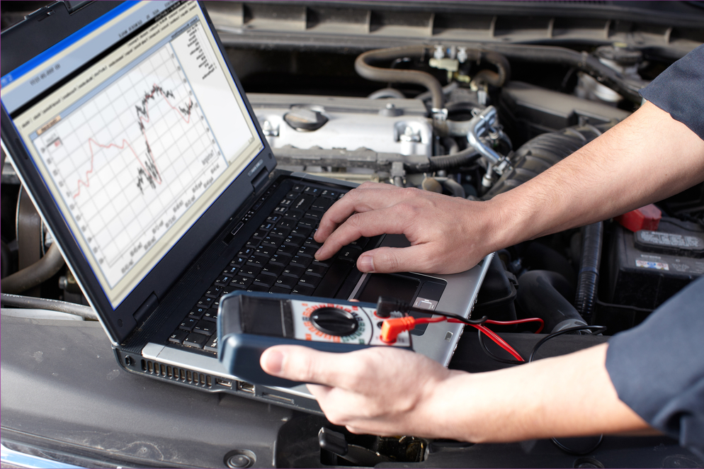 car mechanic on a laptop