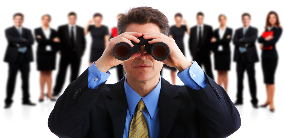 man looking through binoculars