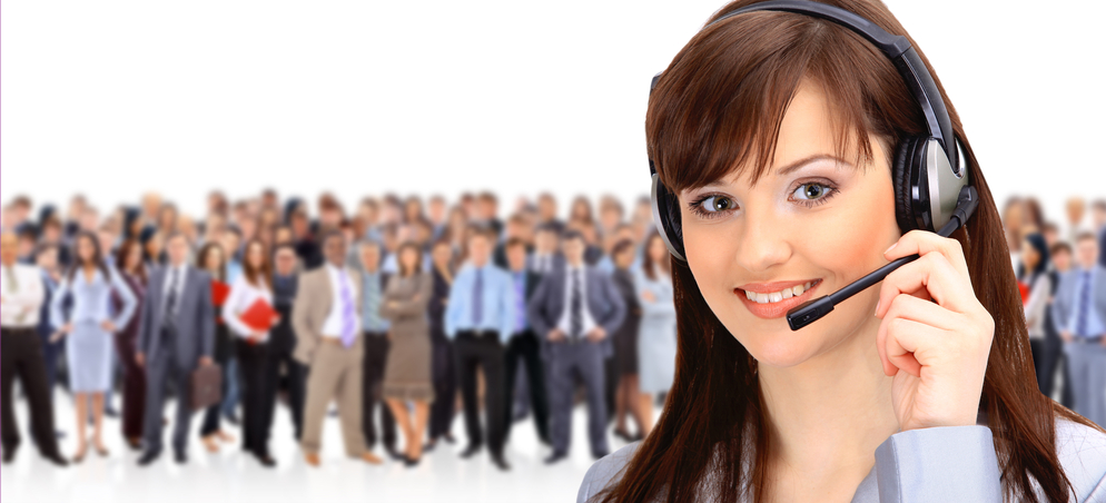 receptionist with a crowd of people behind her