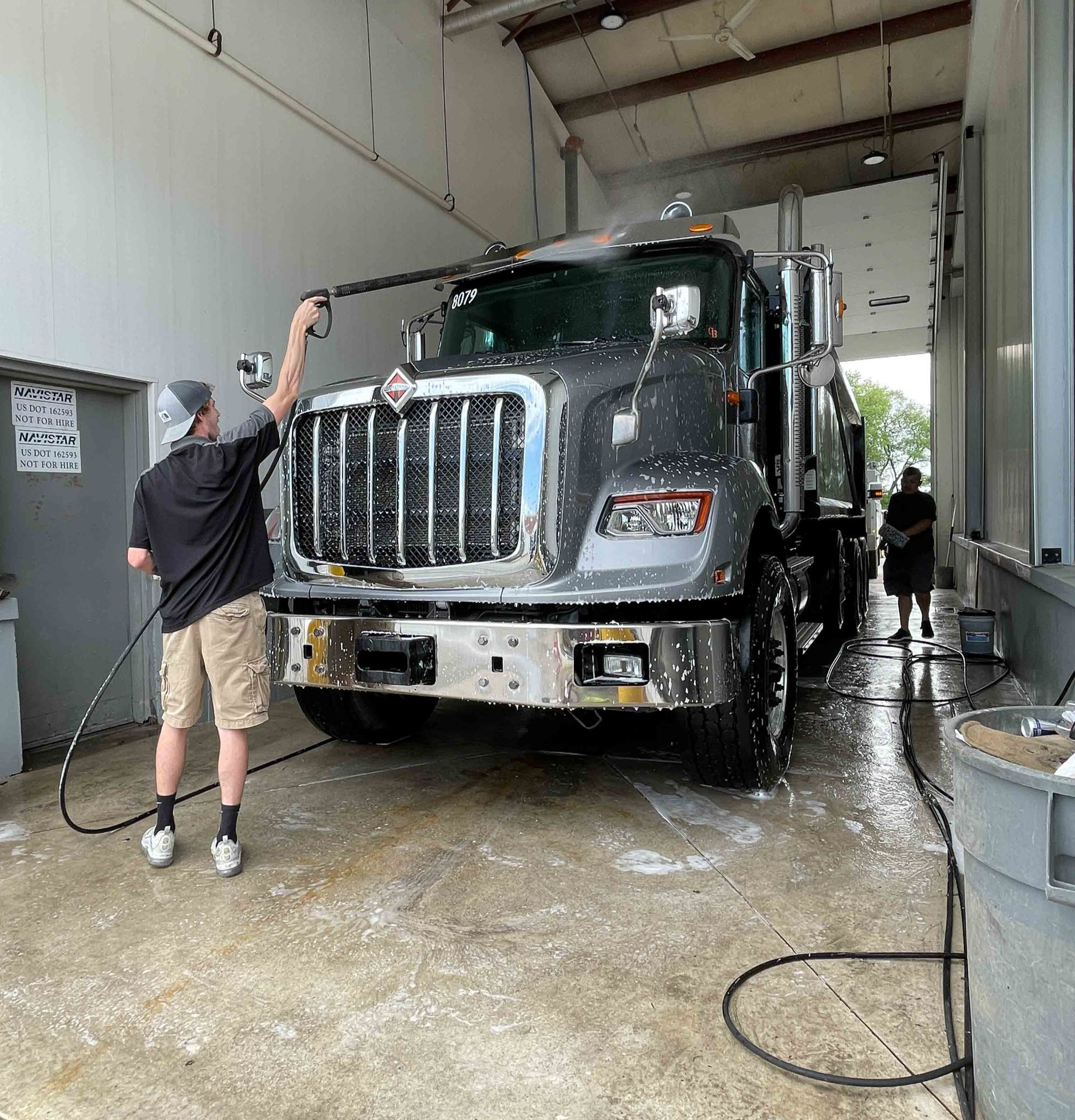 A close up of water drops on the hood of a car