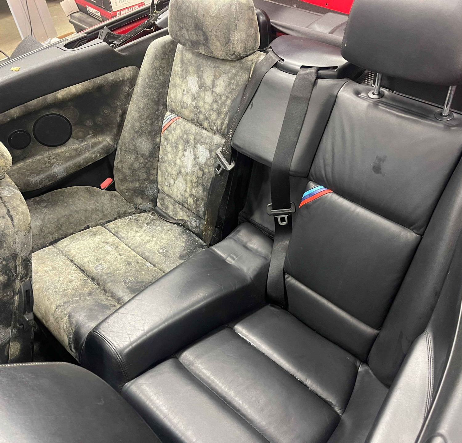 A close up of water drops on the hood of a car