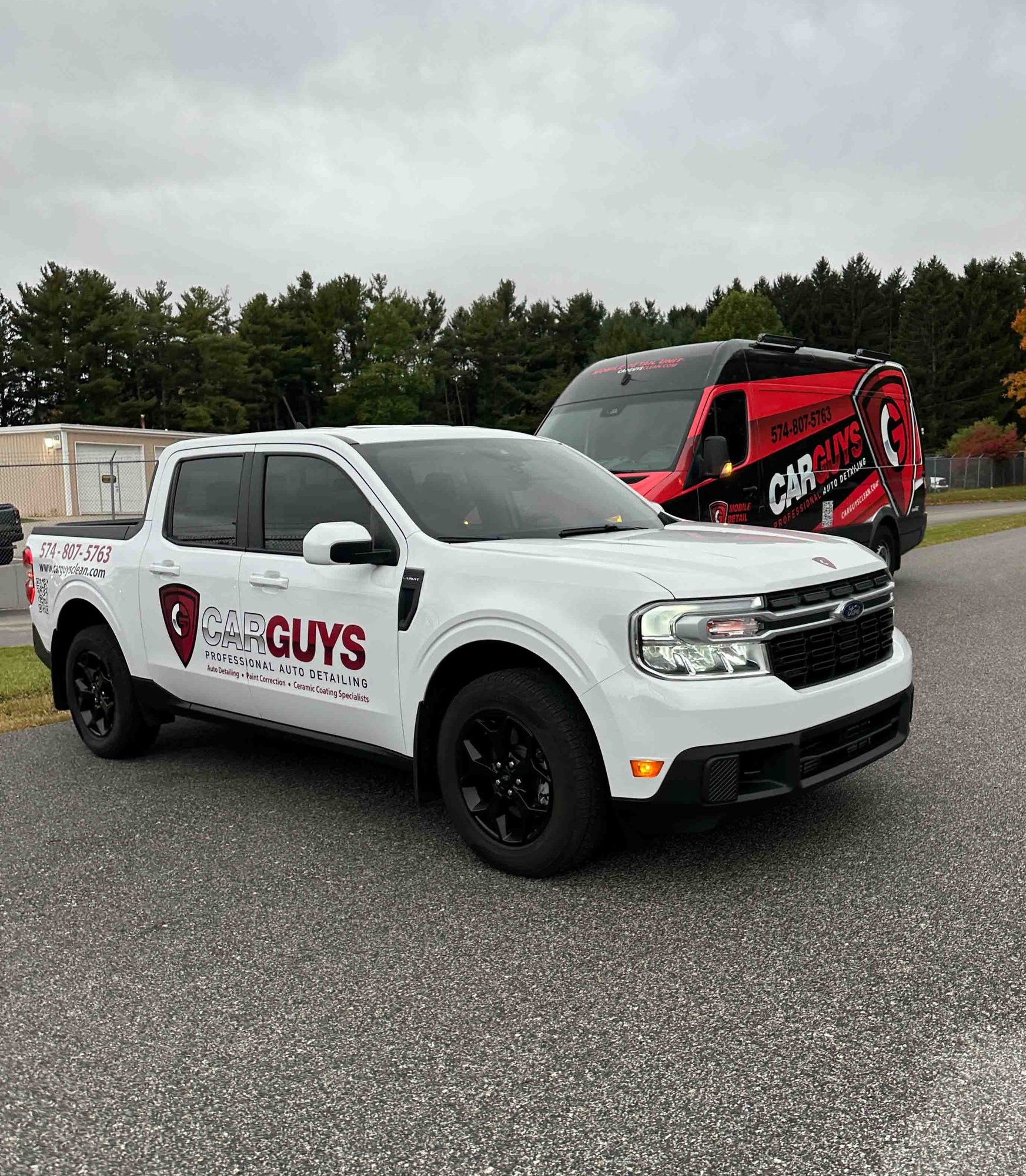 A white Ford Maverick pickup truck parked in a lot, with a red 
