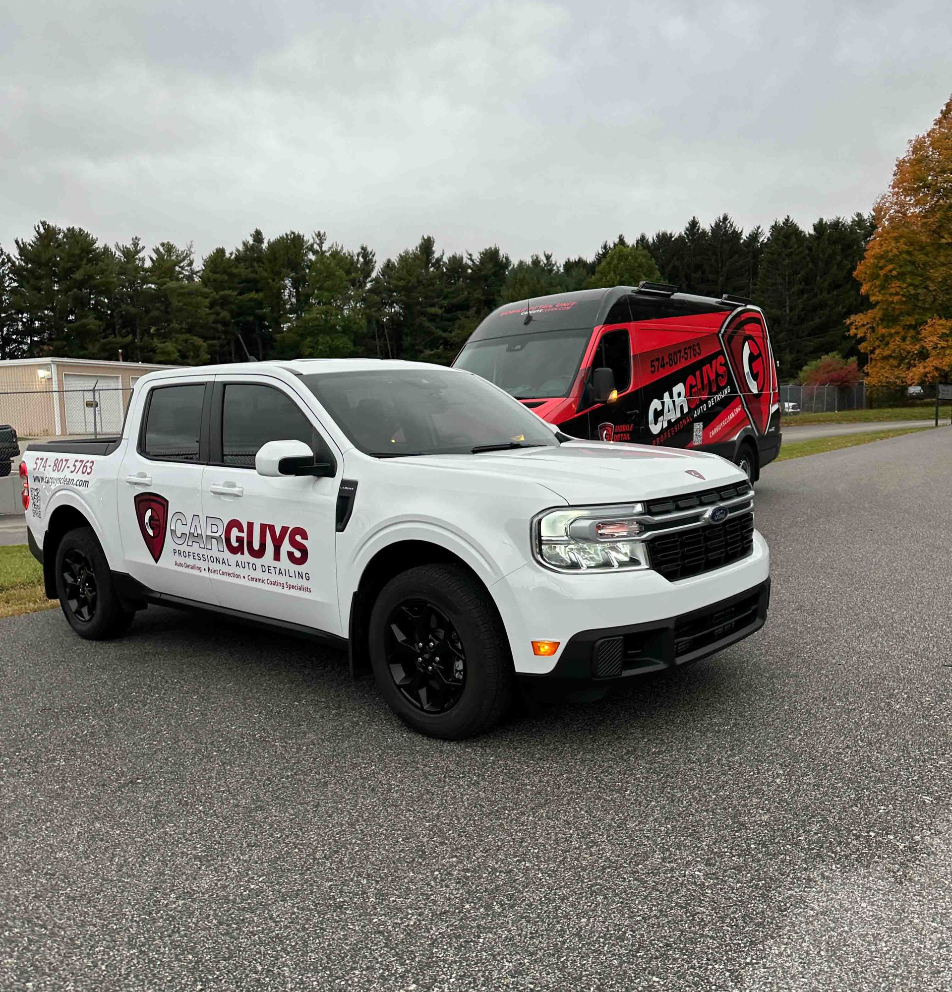 A close up of water drops on the hood of a car