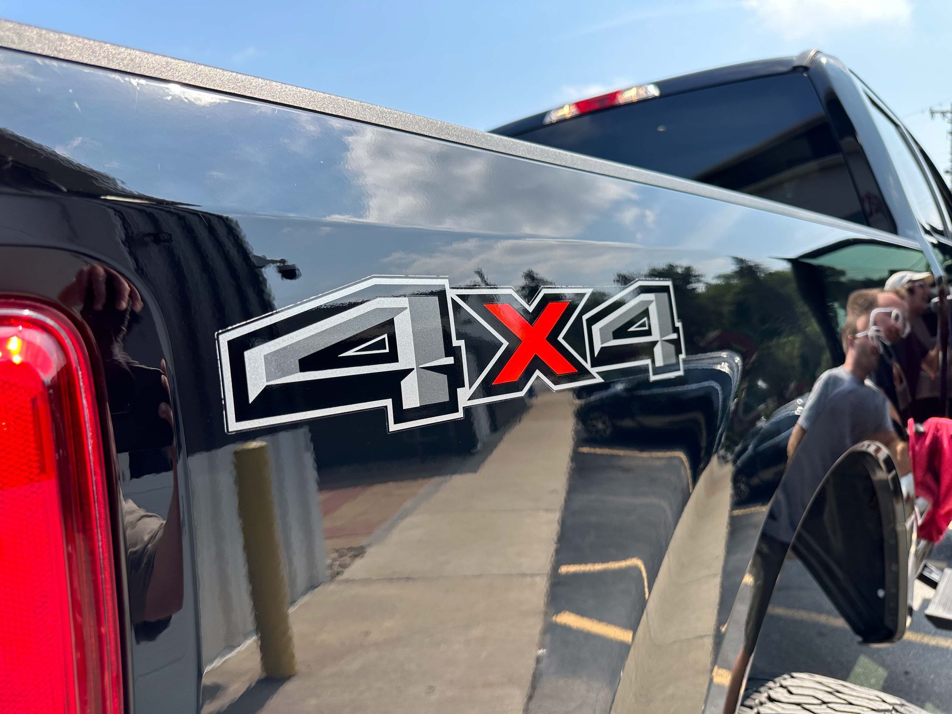 Black truck with 4X4 emblem.