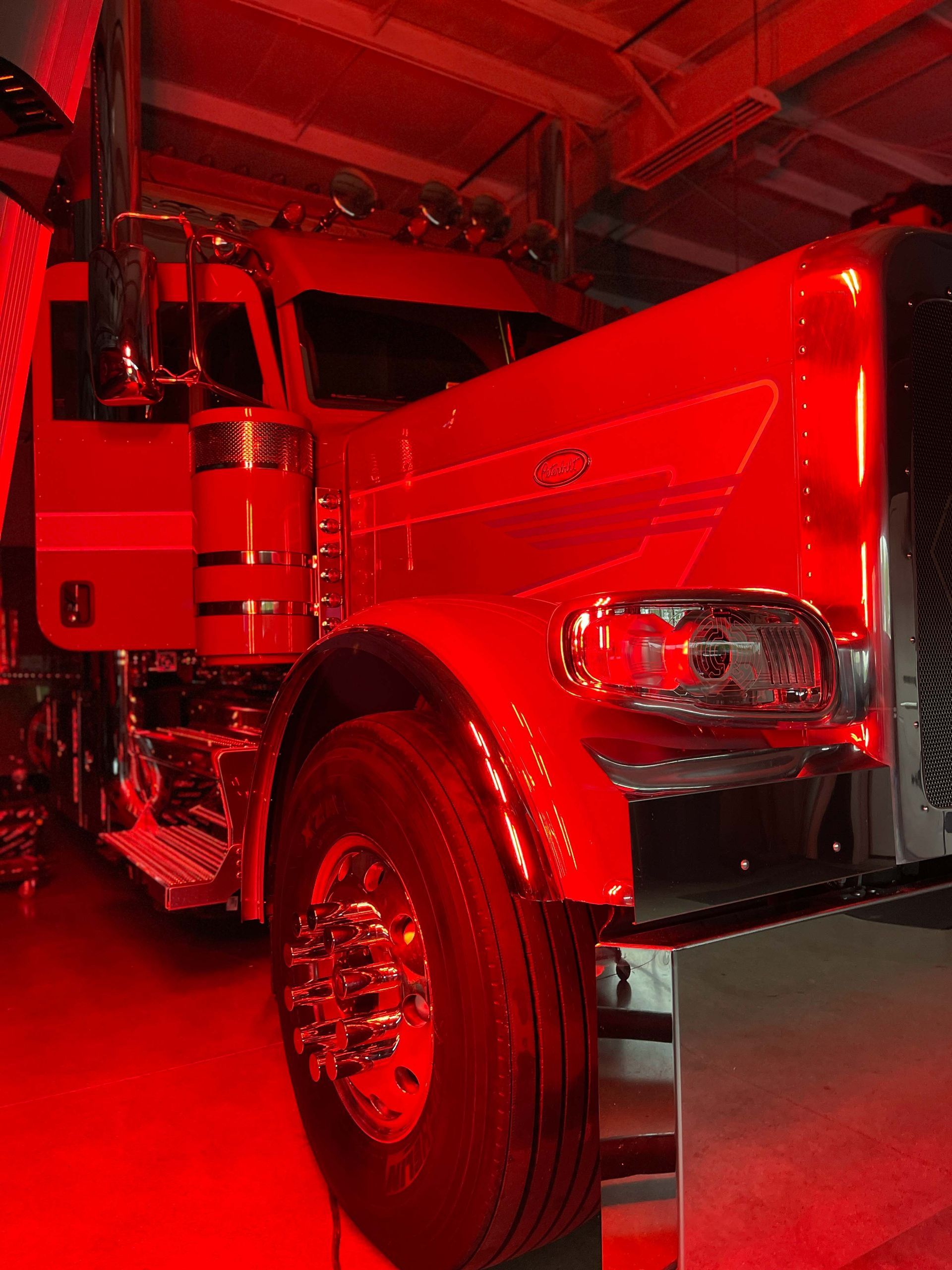 A yellow sports car is parked in a garage.