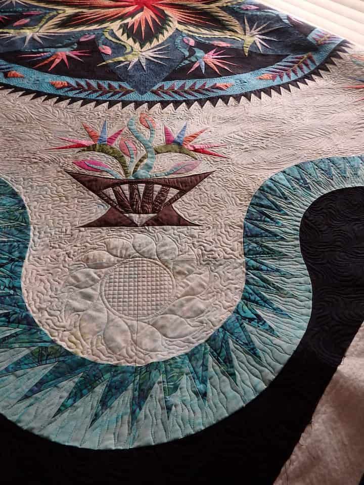 Close-up of a Floral Applique Quilt. Teal, Blue, and Black Fabrics — Morning Star Quilting in Bateau Bay, NSW