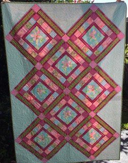 Quilt With Pink, Green, and Blue Diamond Pattern — Morning Star Quilting in Bateau Bay, NSW